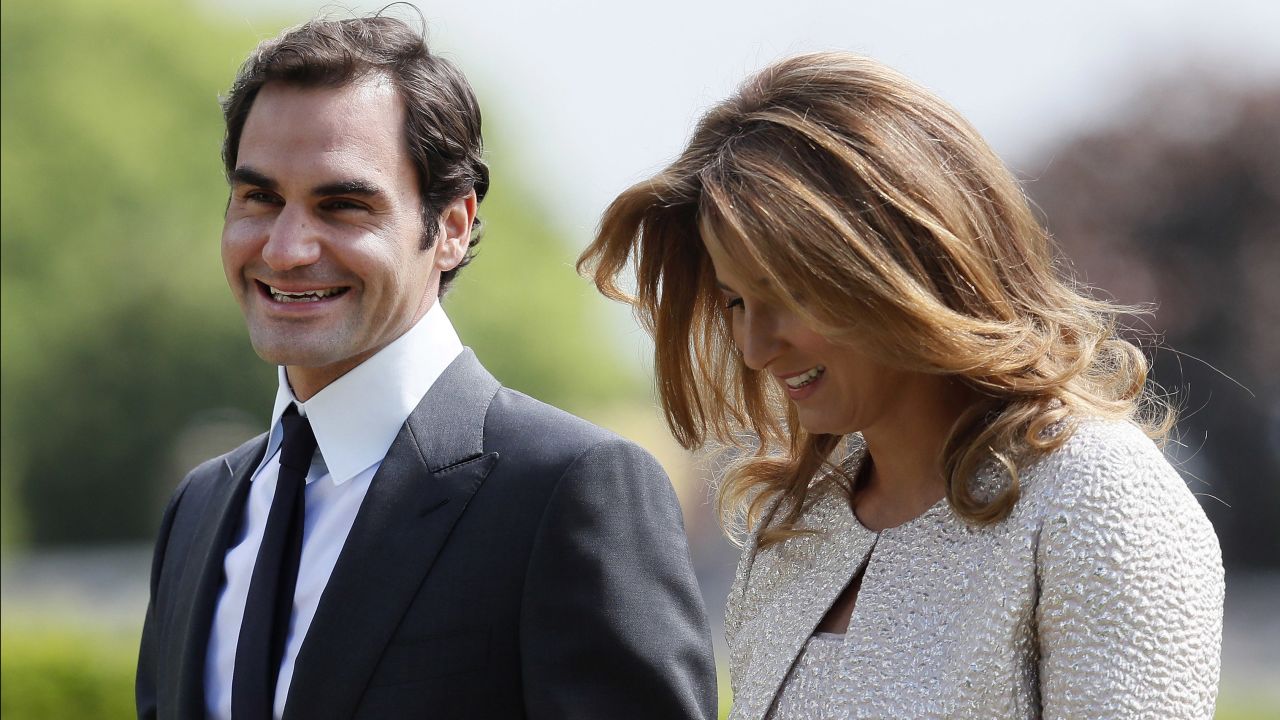 Roger Federer and his wife, Mirka, arrive at the wedding.