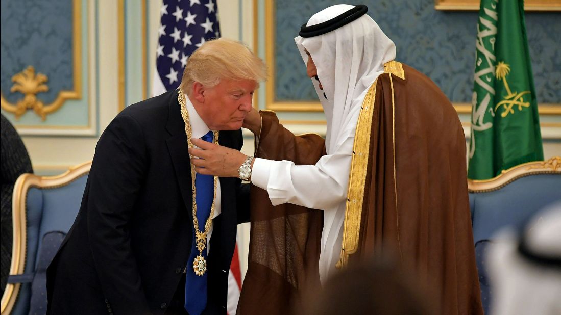 King Salman presents Trump with a gilded necklace and medal, the country's highest honor. The distinction also was bestowed upon Presidents Barack Obama and George W. Bush.