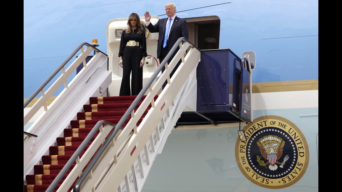 The President and first lady wave from Air Force One after landing in Riyadh.