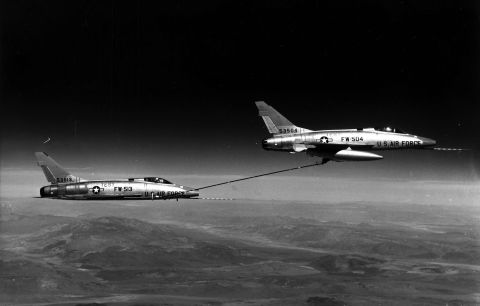 F-100s were the first US supersonic jets capable of refueling each other. The technique was called buddy tanking. The F-100D model included the first supersonic jet autopilot, which freed pilots to use their hands for reading maps or arming weapons.