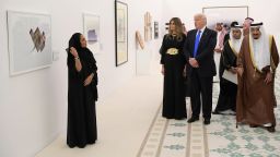 Saudi Arabia's King Salman bin Abdulaziz al-Saud, US President Donald Trump and first lady Melania Trump look at a display of Saudi modern art at the Saudi Royal Court in Riyadh on May 20, 2017. 