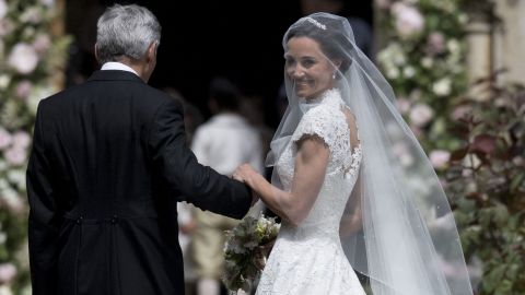 Pippa Middleton and her father, Michael Middleton, stand at St. Mark's Church before the ceremony.