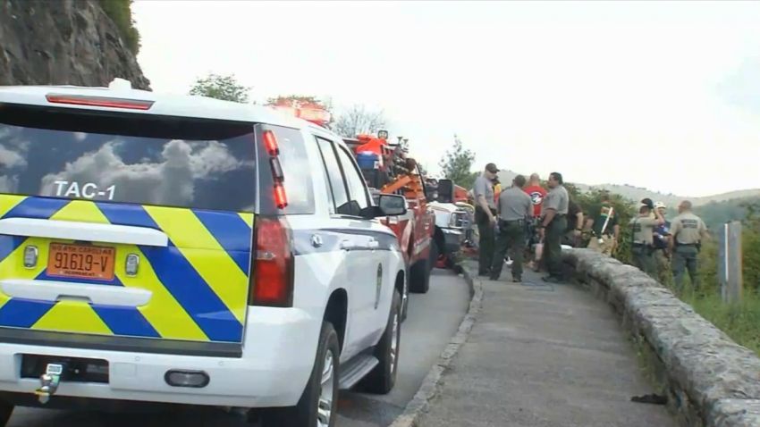 Rescue officials has to rappel 150 feet to retrieve the body of woman who died after falling off Blue Ridge parkway overlook in North Carolina