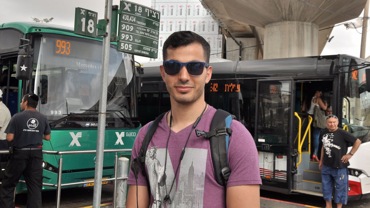 Adi, 29, at the bus station in Haifa. 