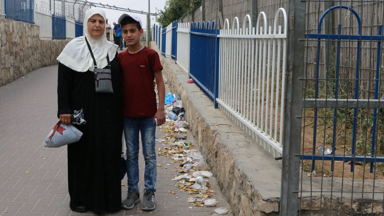 Alia Malash, 55, with her grandson at Checkpoint 300.