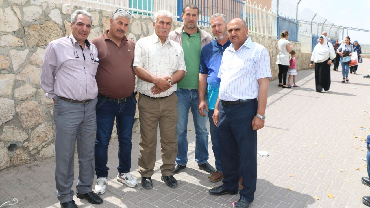 A group of Palestinian men at Checkpoint 300 on their way to pray at Al-Aqsa Mosque.