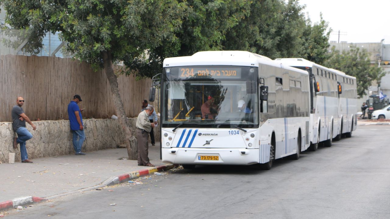 Busses wait at Checkpoint 300 to take Palestinians to Jerusalem.