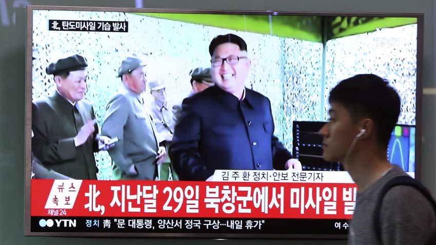 A man passes by a TV at the Seoul Railway Station showing file footage of North Korean leader Kim Jong Un, after North Korea fired a mid-range ballitic millile on Sunday, May 21.