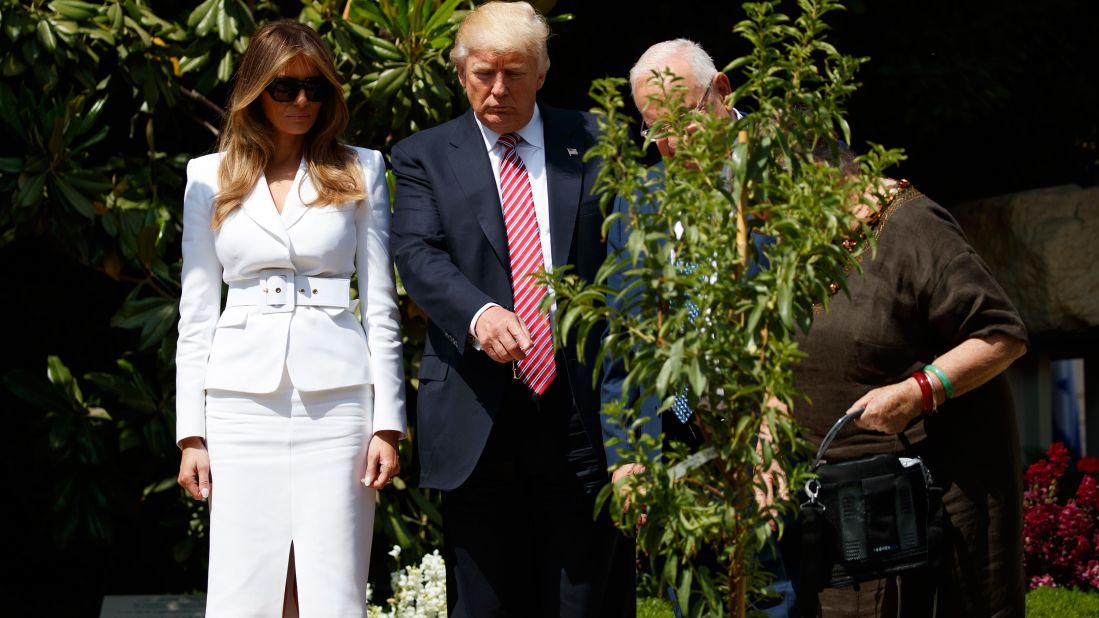 The President and first lady plant a tree in Jerusalem with Israeli President Reuven Rivlin.