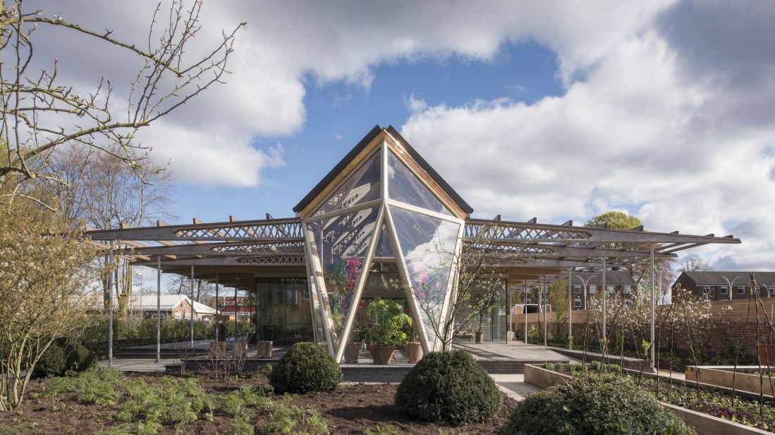 Sir Norman Foster devised a timber-and-glass building for the Maggie's Centre in his hometown of Manchester. The airy facility is surrounded by gardens by landscape designer Dan Pearson and features a greenhouse at the south end of the building.