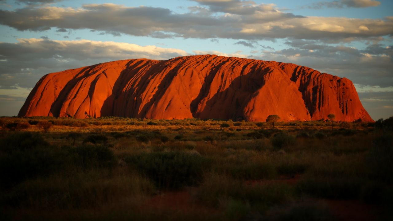 Uluru, a large sandstone formation in central Australia, is sacred to the Indigenous Anangu people and is visited by more than 250,000 people each year.