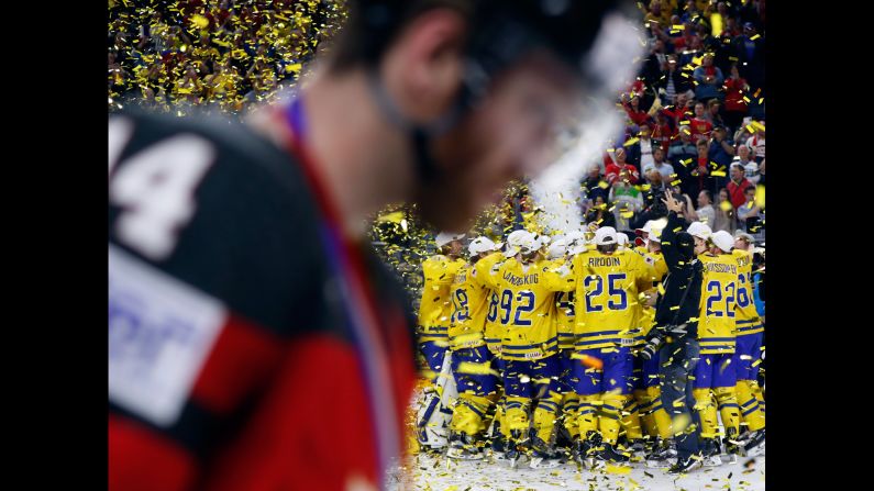 Swedish players celebrate after defeating Canada in the gold-medal game of the Ice Hockey World Championships on Sunday, May 21. Sweden won 2-1 after a penalty shootout.