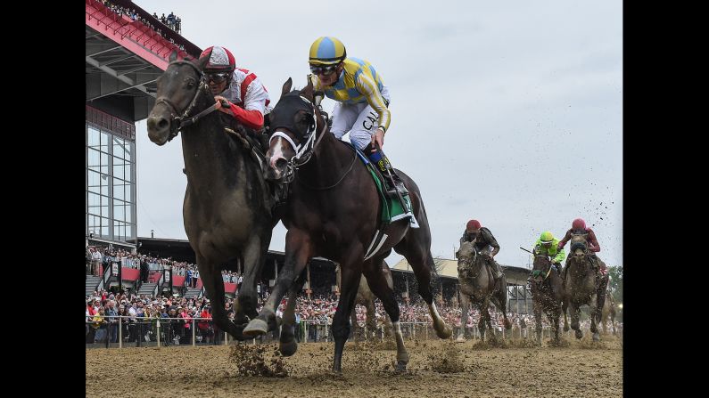 Javier Castellano rides Cloud Computing, left, to a win at <a href="index.php?page=&url=http%3A%2F%2Fwww.cnn.com%2F2017%2F05%2F20%2Fsport%2Fpreakness-stakes-cloud-computing%2F" target="_blank">the Preakness Stakes</a> on Saturday, May 20. Finishing a close second was Classic Empire, ridden by Julien Leparoux.