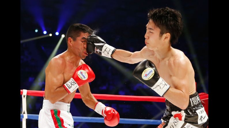 Shiro Ken lands a right hand against Ganigan Lopez during their title bout in Tokyo on Saturday, May 20. Ken won a majority decision to take home the WBC's light-flyweight belt.