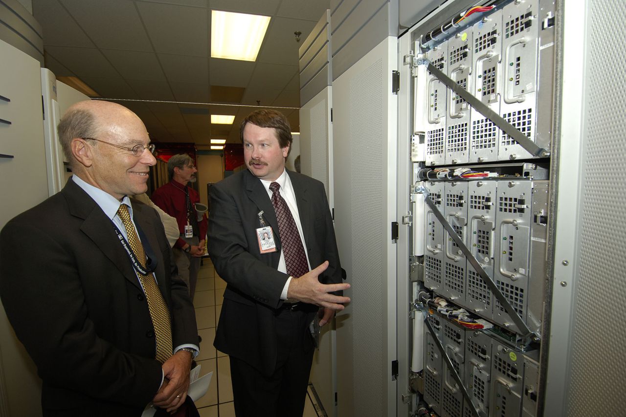 This US-built supercomputer was the first to break the 1 teraflop barrier (performing 1 trillion calculations per second). It was the fastest supercomputer in the world from 1997 to 2000, and also the first supercomputer installation to use more than 1 megawatt of power.<br /><br />Pictured here, VP Rick Stulen and Intel designer Stephen Wheat look at the innards of an ASCI Red rack. <br />