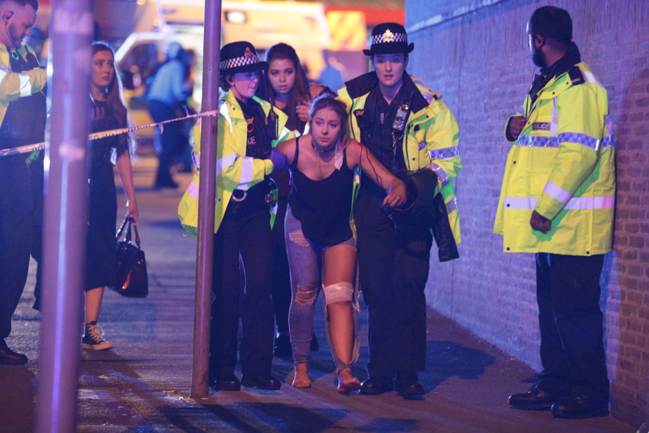 Police help someone after the attack at Manchester Arena on Monday, May 22.