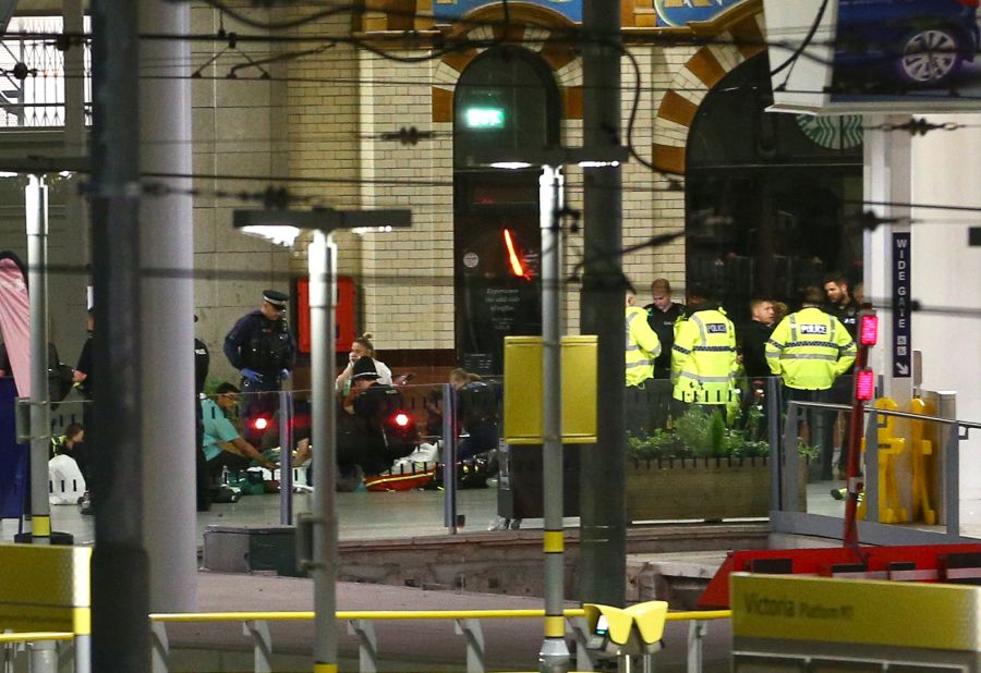 People receive medical attention at a railway station close to the arena. The incident happened shortly after Grande had left the stage, shortly after 10:30 p.m. (5:30 p.m. ET) according to eyewitnesses. Calvin Welsford, an 18-year-old concertgoer, said that he heard a "loud bang" a couple of minutes after Grande's set had finished.