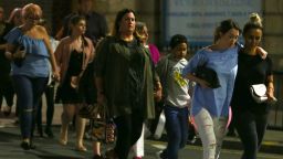 MANCHESTER, ENGLAND - MAY 23: Members of the public are escorted from the Manchester Arena on May 23, 2017 in Manchester, England.  An explosion occurred at Manchester Arena as concert goers were leaving the venue after Ariana Grande had performed.  Greater Manchester Police have confirmed 19 fatalities and at least 50 injured. (Photo by Dave Thompson/Getty Images)