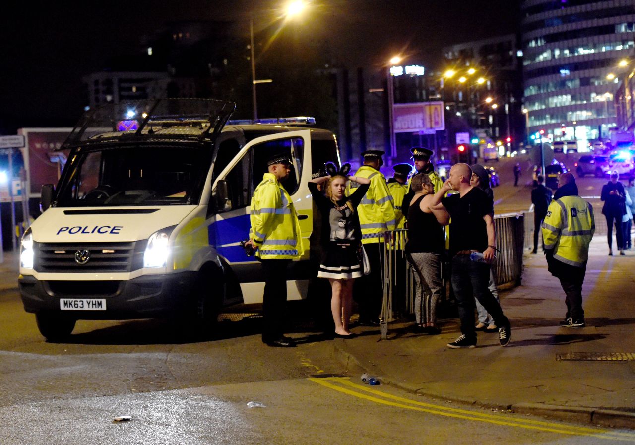 People gather outside the arena. "We can confirm there was an incident as people were leaving the Ariana Grande show last night," police said on Twitter early on Tuesday. "The incident took place outside the venue in a public space. Our thoughts and prayers go out to the victims."