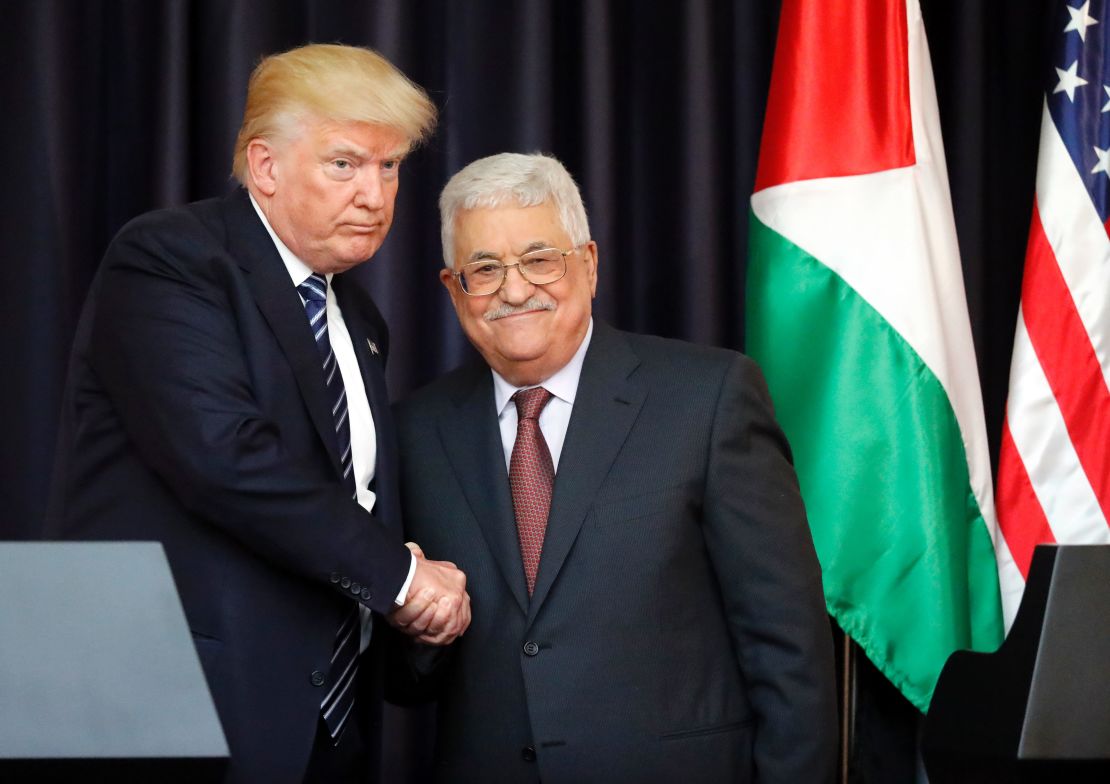 US President Donald Trump, left, and Palestinian leader Mahmoud Abbas shake hands at the presidential palace in  Bethlehem on May 23, 2017.