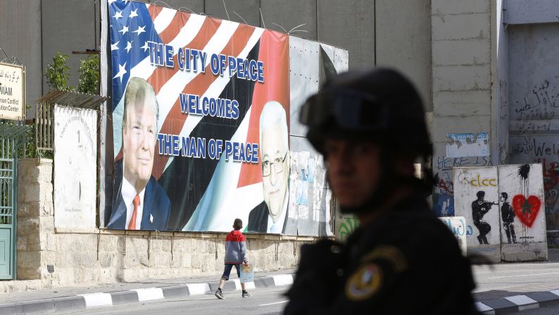 A Palestinian security official takes position before the arrival of Trump's convoy in Bethlehem, West Bank.