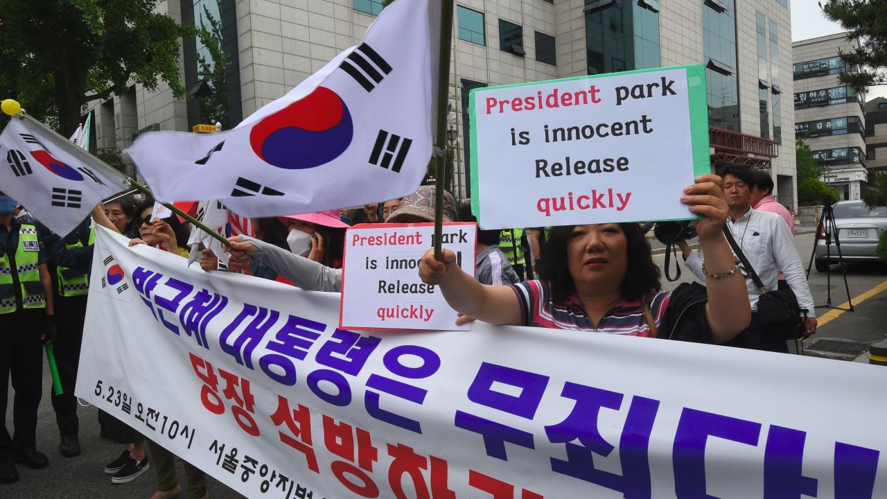 Supporters of South Korea's ousted president Park Geun-Hye gather outside the Seoul Central District Court in Seoul on May 23, 2017 before Park's arrival at the court.