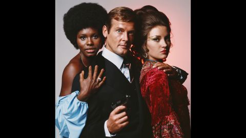 English actor Roger Moore is flanked by Gloria Hendry, left, and Jane Seymour in this photo from the James Bond movie "Live and Let Die" in 1973. Moore, who portrayed Bond in seven films, <a href="http://www.cnn.com/2017/05/23/entertainment/roger-moore-dies/" target="_blank">died Tuesday, May 23,</a> at the age of 89.