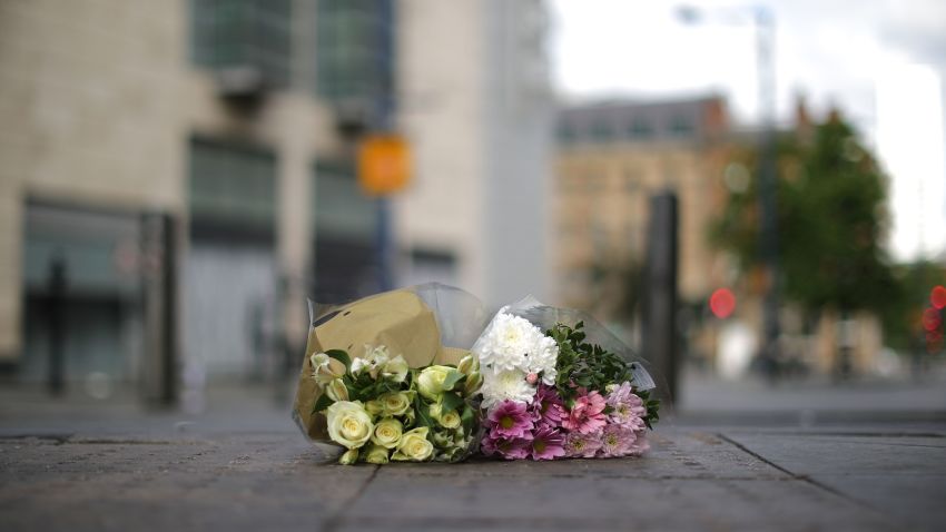 MANCHESTER, ENGLAND - MAY 23:  The first floral tributes to the victims of the terrorist attack are placed on the empty streets on Shudehill, May 23, 2017 in Manchester, England.  An explosion occurred at Manchester Arena as concert goers were leaving the venue after Ariana Grande had performed. Greater Manchester Police are treating the explosion as a terrorist attack and have confirmed 22 fatalities and 59 injured.  (Photo by Christopher Furlong/Getty Images)