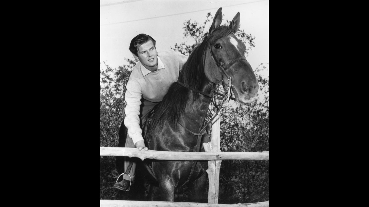 Moore rides a horse in Hollywood circa 1955. He moved to the United States in 1953 and made his American television debut in the Hallmark Hall of Fame's production of "Julius Caesar."