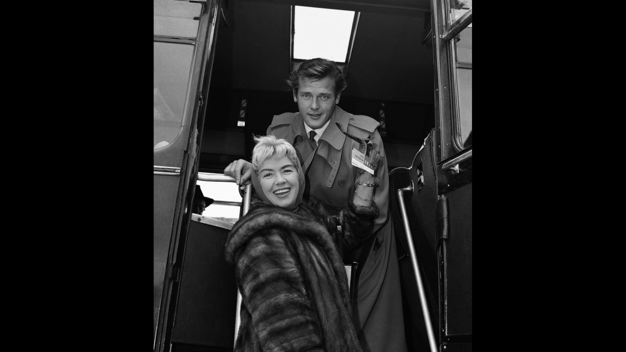 Moore and his wife at the time, singer Dorothy Squires, prepare to leave London after a two-week vacation in 1959. Moore was married four times.