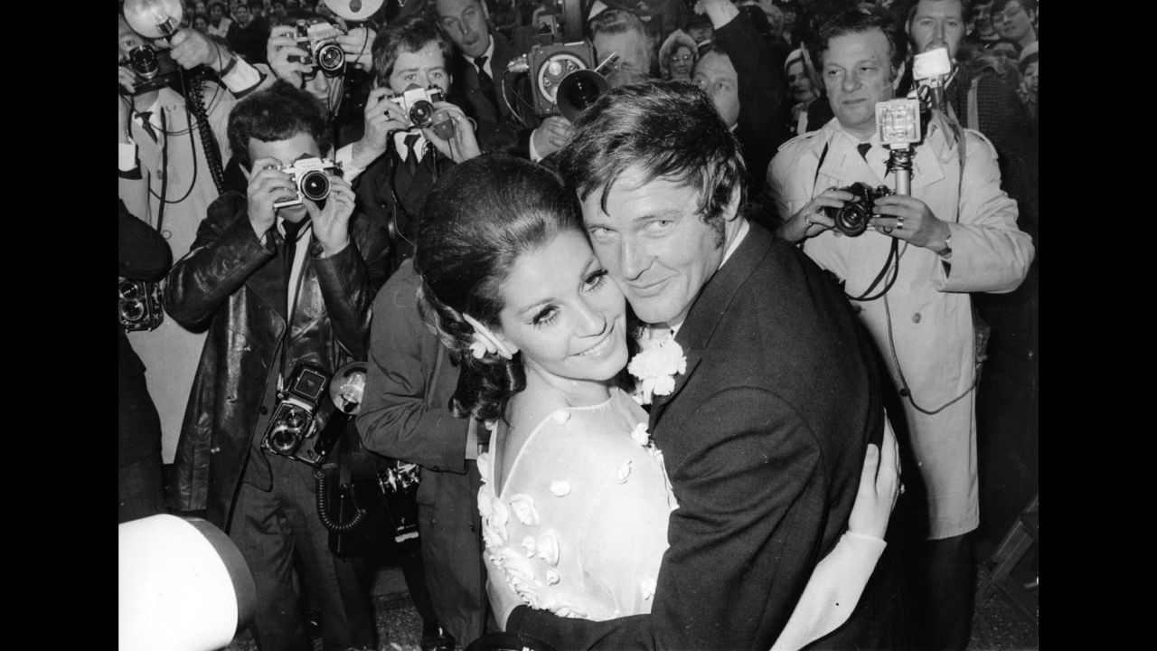 Moore and his third wife, actress Luisa Mattioli, are photographed at their wedding ceremony in 1969.