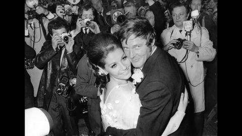 Moore and his third wife, actress Luisa Mattioli, are photographed at their wedding ceremony in 1969.
