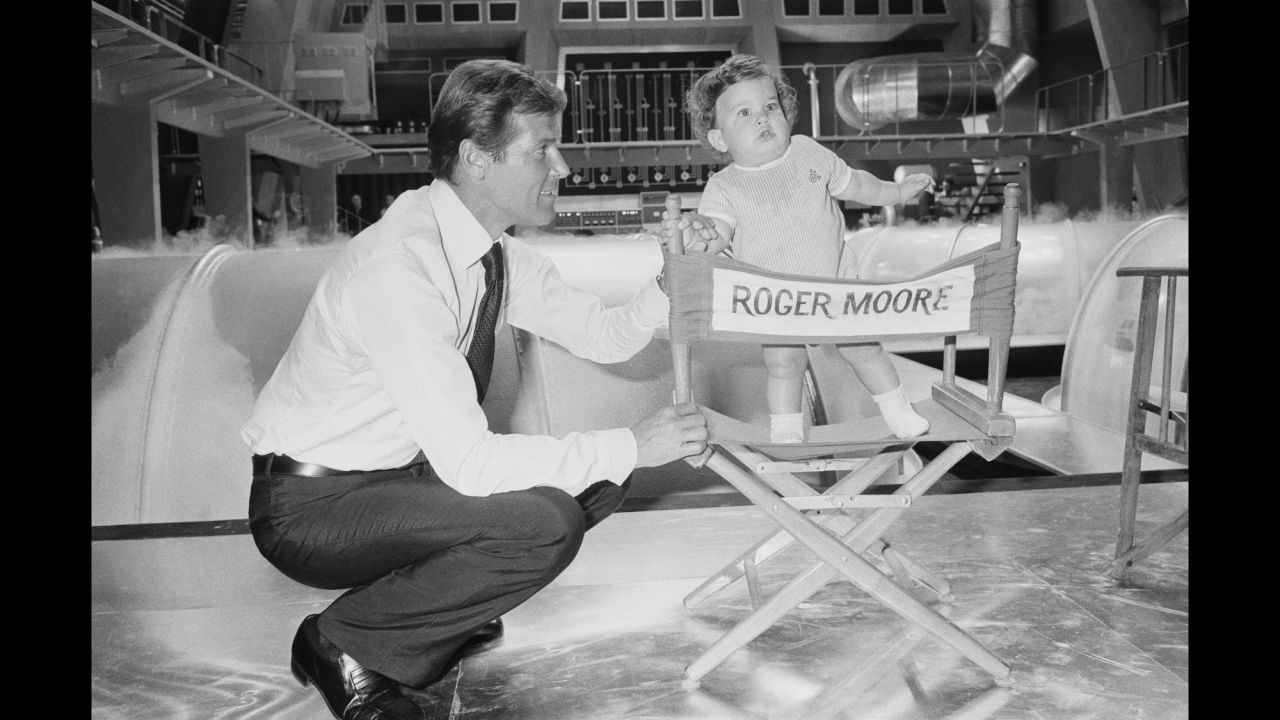 Moore brings his 1-year-old son, Christian,  on the set of the 1974 film "The Man with the Golden Gun."