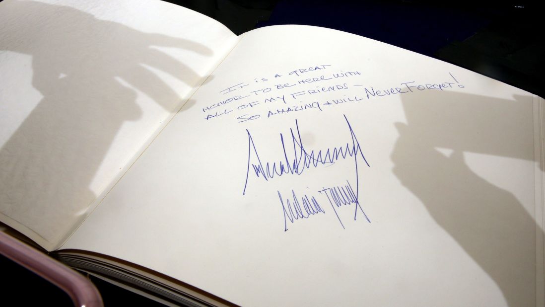 People take pictures of the message Trump wrote at Yad Vashem, the Holocaust memorial in Jerusalem, on May 23.