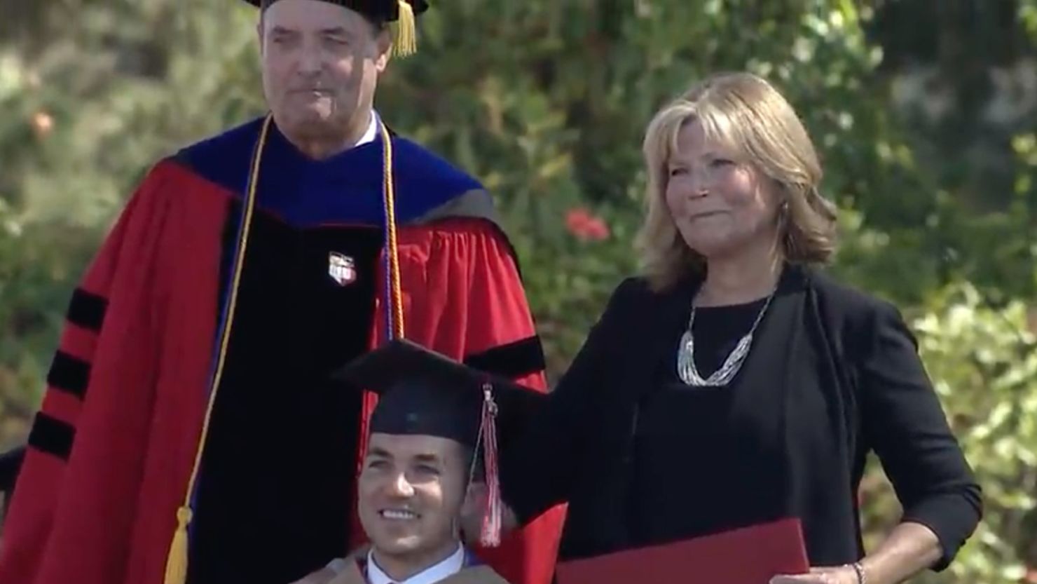 Judy O'Connor and her son Marty pose on graduation day.