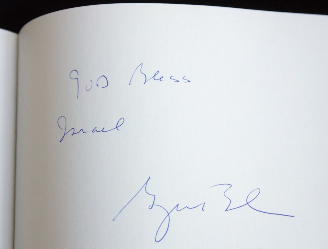 A note reading, " God Bless Israel, George Bush" is seen on the Yad Vashem Holocaust memorial' guest book during a visit by US President George W. Bush in Jerusalem, 11 January 2008. 