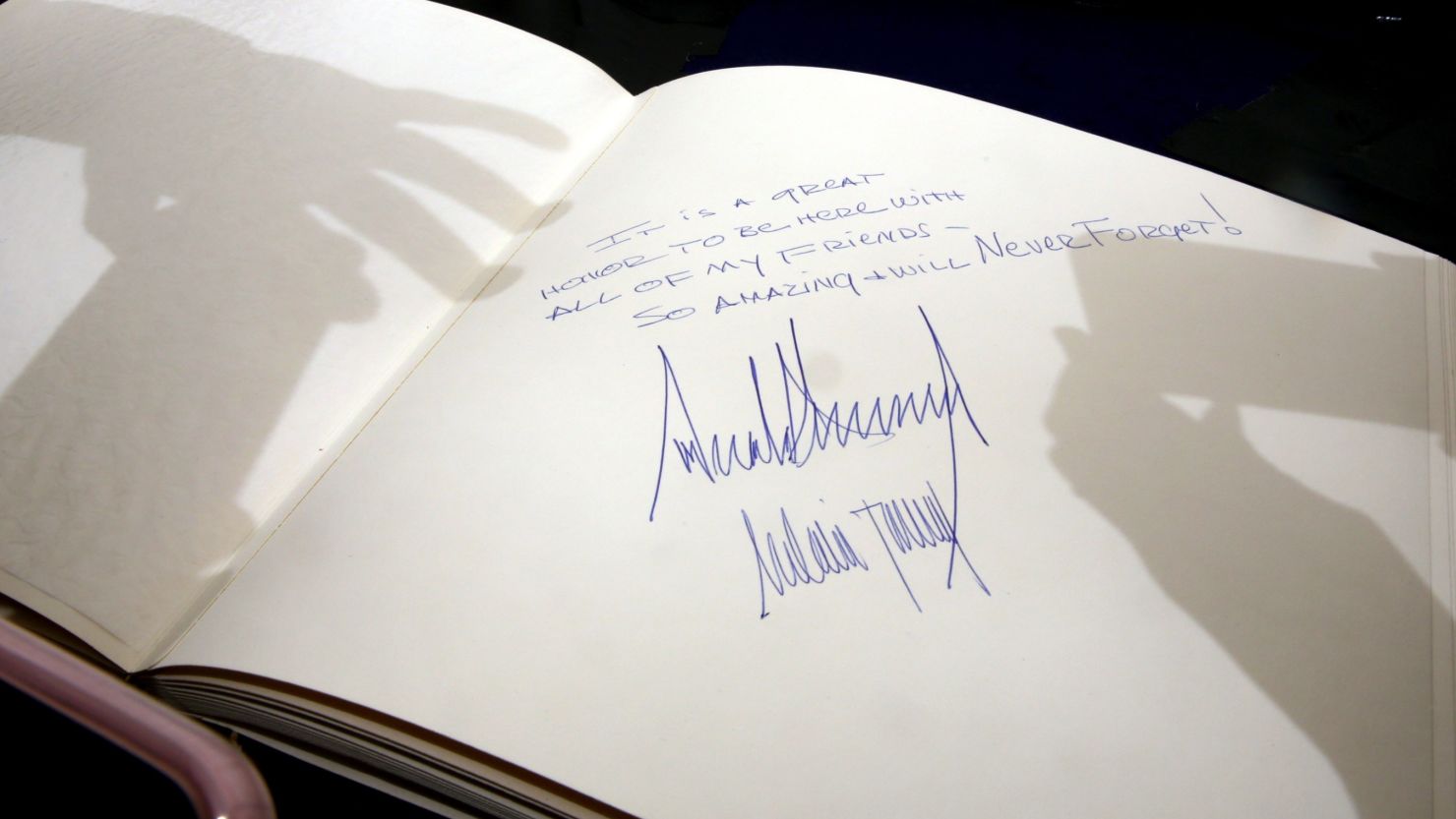 The message written by US President Donald Trump at the Yad Vashem Holocaust Memorial Museum guest book and signed by him and his wife Melania is seen after their visit on May 23, 2017, in Jerusalem. 