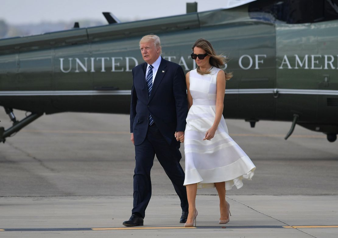 US President Donald Trump and First Lady Melania Trump make their way to board Air Force One before departing from Ben Gurion International Airport in Tel Aviv on May 23, 2017. 