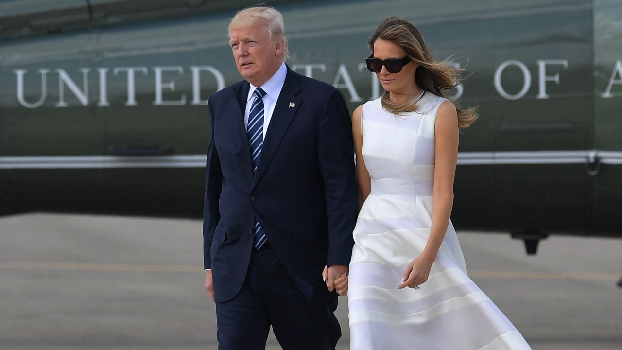US President Donald Trump and First Lady Melania Trump make their way to board Air Force One before departing from Ben Gurion International Airport in Tel Aviv on May 23, 2017.