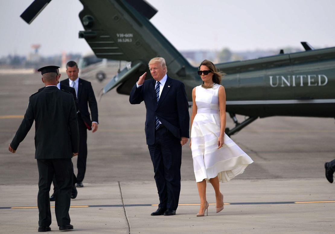 US President Donald Trump and First Lady Melania Trump make their way to board Air Force One before departing from Ben Gurion International Airport in Tel Aviv on May 23, 2017. 