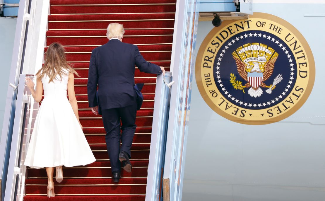 US President Donald Trump (R) and his wife, First Lady Melania Trump, board Air Force One from Ben Gurion International Airport in Tel Aviv on May 23, 2017, bound for Rome.