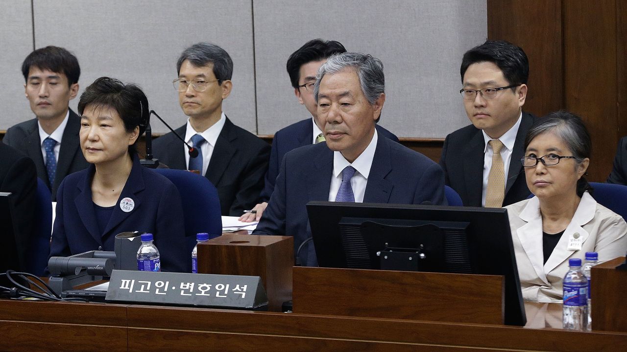 Former South Korean President Park Geun-hye (left) sits with her longtime friend Choi Soon-sil (right) at the Seoul Central District Court on May 23.