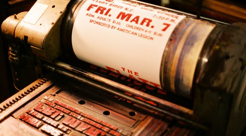 Wooden and metal lettering is hand-set to create the type seen on a wide range of promotional posters.