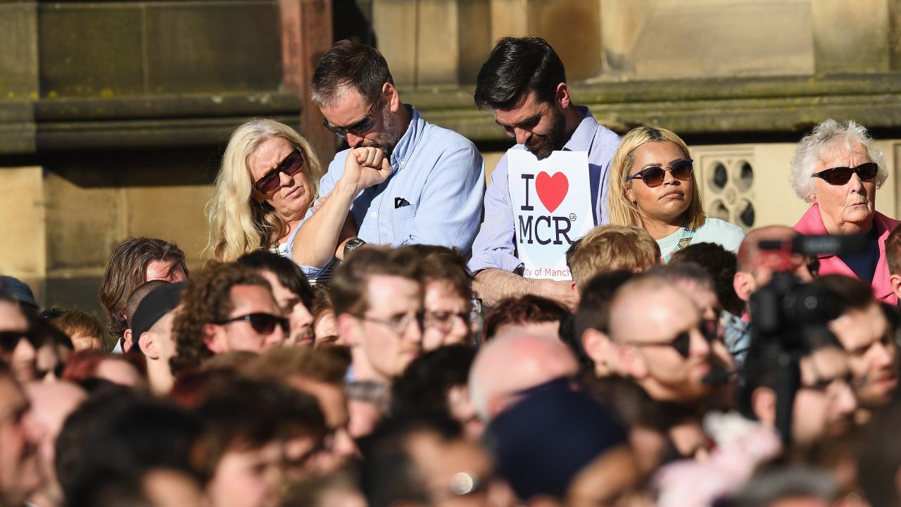 People gather at a vigil Tuesday in Manchester to honor victims of Monday night's terror attack.