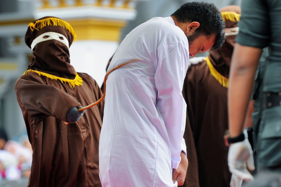 An Indonesian man, one of two to be publicly caned for having homosexual sex, is punished in Banda Aceh on May 23, 2017.