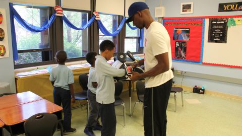 Students at Deneen School of Excellence gear up for an after-school boxing lesson.