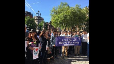 Imams and Muslim youth join the hundreds who attended Tuesday's vigil outside Manchester City Hall.