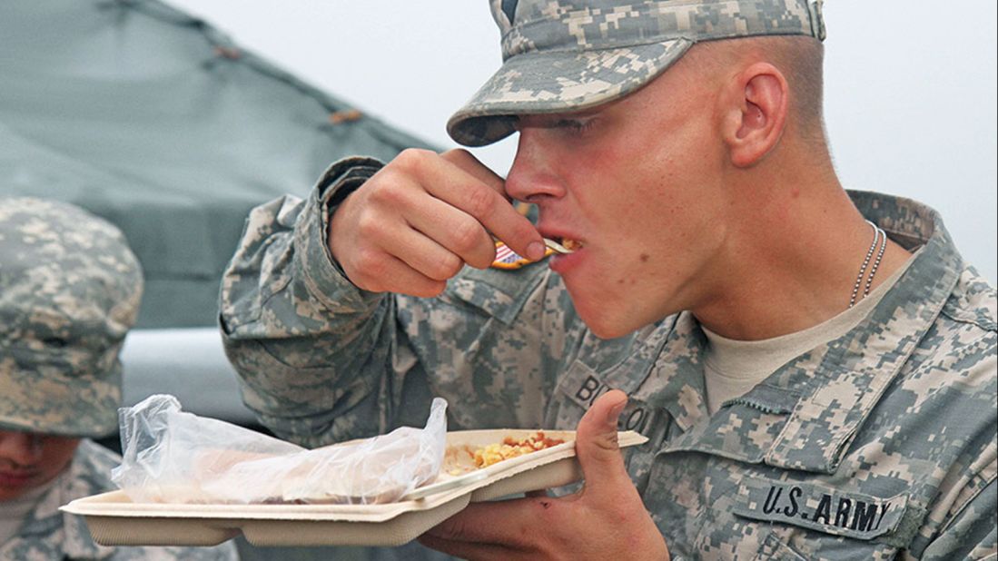 Food served in the field must be as nutritious as that served back at base, and the military says it makes sure it's also tasty by conducting frequent field tests. Health care specialist Earl Buelow eats a forkful of scrambled eggs and salsa during a heat-and-serve menu testing at Fort Riley, Kansas.