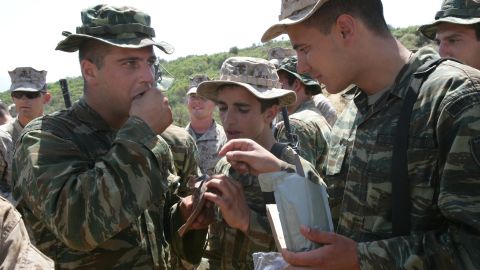 The Department of Defense says it's proud of the meal offerings for combat troops in the field. Here, members of the 22nd Marine Expeditionary Unit offer Greek soldiers a chance to taste MREs at a training area outside Volos, Greece.  <br />
