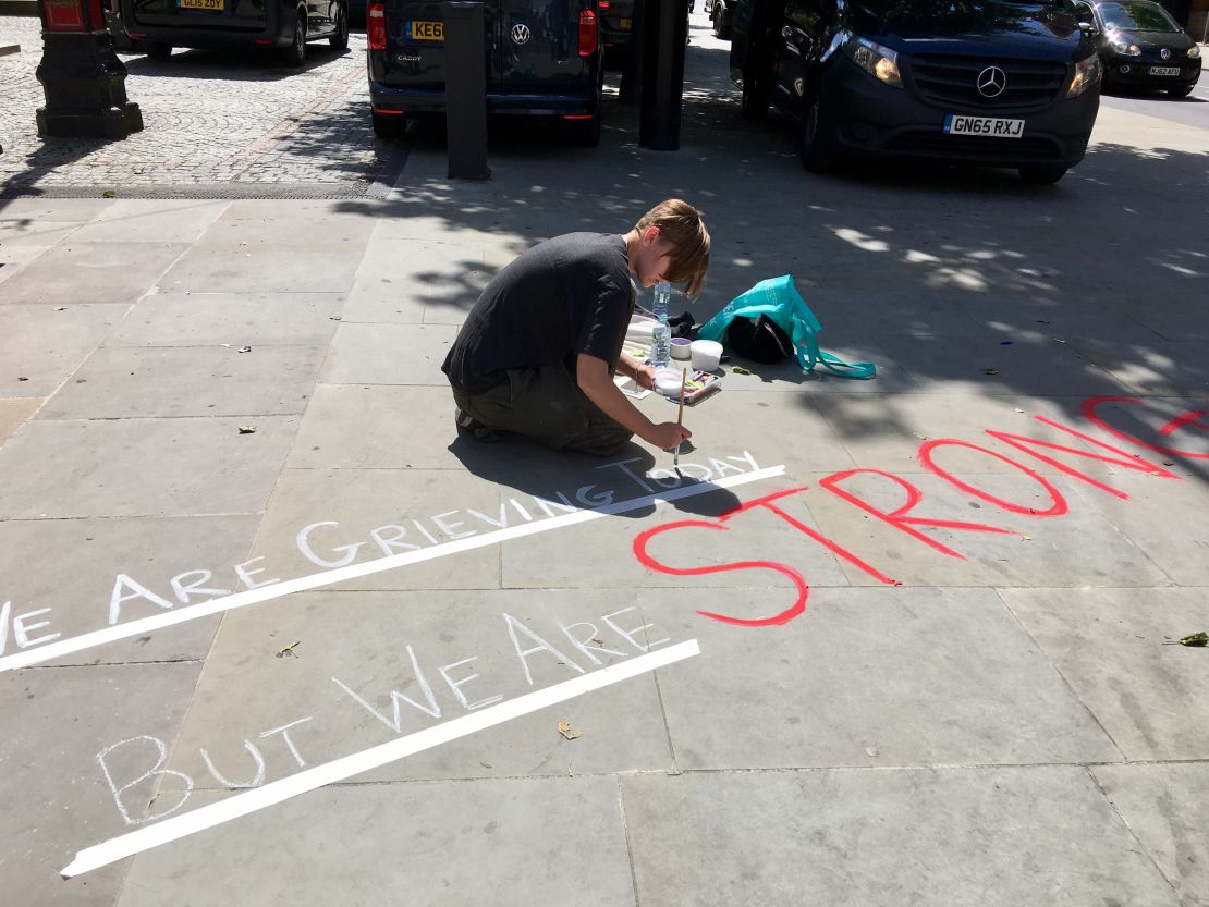 Rachel Harrington draws in Albert Square to show her support for people caught up in the terror.